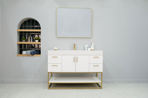 A bathroom with a mirror and sink featuring the Solana 48