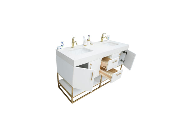 A modern white double-sink bathroom vanity with gold faucets, open drawers, and cabinets displaying wooden interiors. Items like toothbrushes and soap are placed on the countertop.