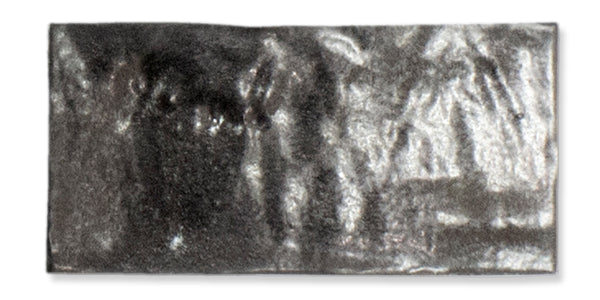 A rectangular, shiny silver-gray metal ingot with a slightly rough and uneven surface texture, set against a white background.