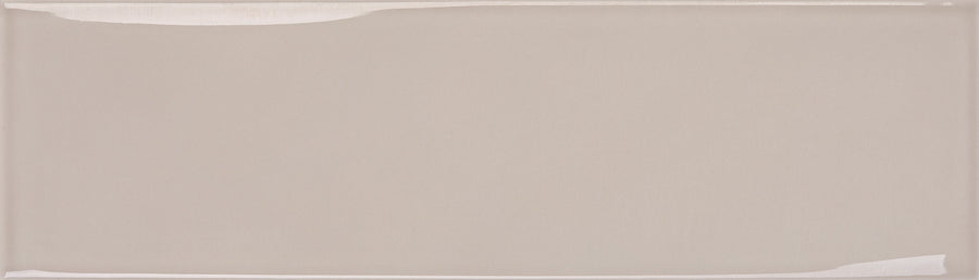 The Maestro 3" x 10" Subway Tile in Bach Glossy is a rectangular, light beige ceramic tile with a smooth, reflective finish and subtly raised edges—ideal for modern kitchen backsplashes or contemporary bathroom walls.