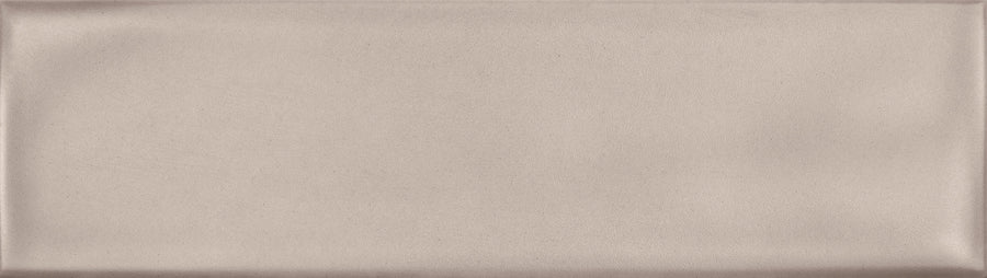 The Maestro 3" x 10" Subway Tile in Bach Matte features a rectangular design with a smooth surface and subtle raised border, ideal for use as a bathroom wall tile or kitchen backsplash.