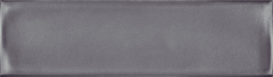 The Maestro 3" x 10" Subway Tile in Amadeus Matte features a rectangular shape, smooth surface, metallic gray color, and subtle shading with soft edge highlights for a refined bathroom wall finish.
