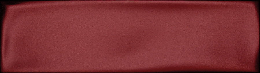 The Maestro 3" x 10" Subway Tile in Mozart Matte features a rich, deep red hue with subtle shading and a velvety finish, making it an elegant choice for a stylish kitchen backsplash.