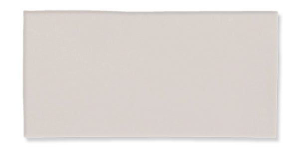 A plain, rectangular, off-white or light gray tile with a smooth surface and slightly irregular edges, displayed against a white background.