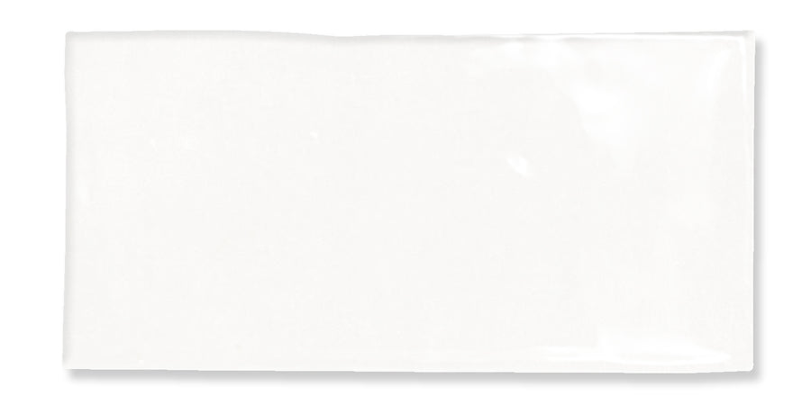 A plain white rectangular napkin is laid flat against a white background, with slight shadows along the edges.