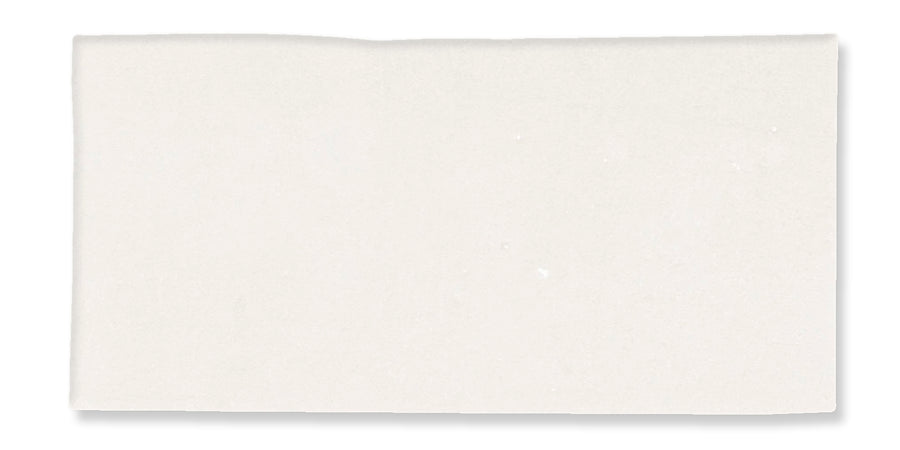 A plain, rectangular white sheet of paper with a slightly uneven top edge, set against a white background.