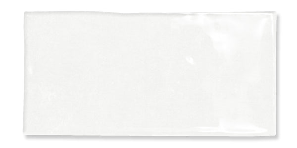 A glossy white rectangular subway tile with a slightly uneven surface and smooth edges, photographed against a white background.