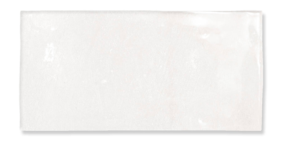 A rectangular, glossy white tile with slightly uneven surface texture and subtle variations in shading, photographed against a white background.