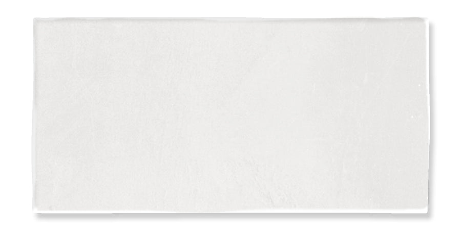 A rectangular white towel laid flat on a white background, showing its smooth and clean texture.