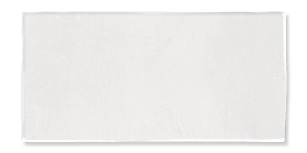 A rectangular white towel laid flat on a white background, showing its smooth and clean texture.