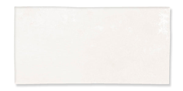 A plain, rectangular sheet of white paper with a subtle texture, photographed against a white background.