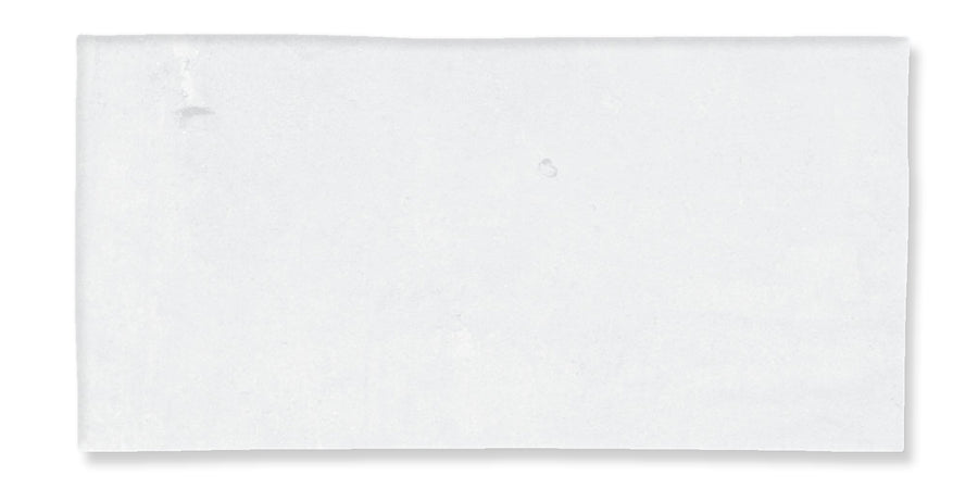 A plain, rectangular white paper napkin lying flat on a white background. There are no patterns or visible designs on the napkin.