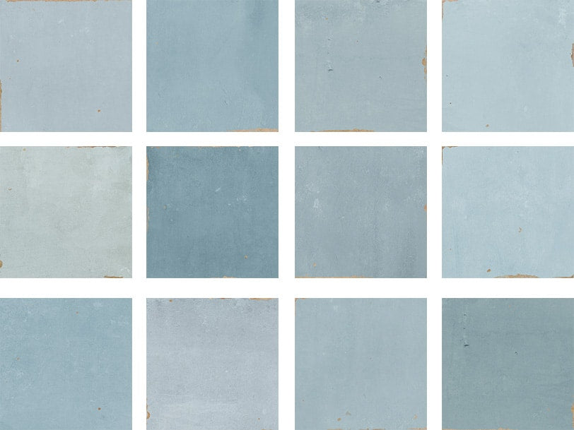 Twelve square tiles arranged in a 3x4 grid, each in varying shades of blue and light gray, with subtle texture and slightly worn edges.