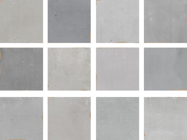 Twelve square tiles in varying shades of gray are arranged in a 3x4 grid, separated by white borders. Each tile shows slight differences in tone and texture, with some having small imperfections or worn edges.