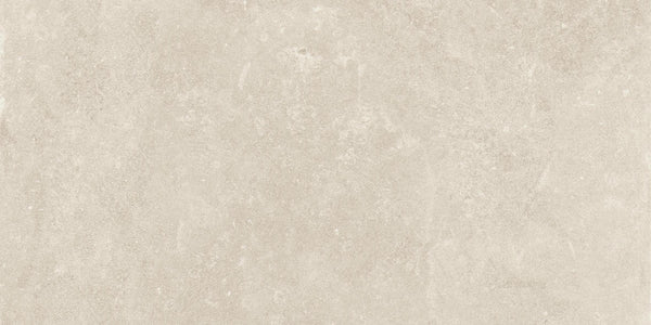 Revolve 12x24 Rectified Porcelain Tile offers a light beige, stone-like look with soft color variations and subtle speckling, creating a sophisticated, natural appearance and a non-slip floor finish.