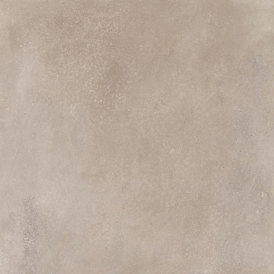 The Portland 24x24 Porcelain Tile features a textured surface in light beige and sandy-brown tones with subtle variations and speckles, capturing the natural charm and authentic imperfections of stone.