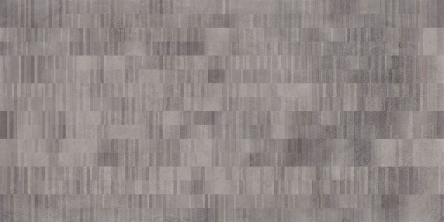 The Portland 24x48 Porcelain Tile features a modern, geometric look with an abstract pattern of small, rectangular grey tiles in varying shades and subtle imperfections, inspired by the Portland Collection.
