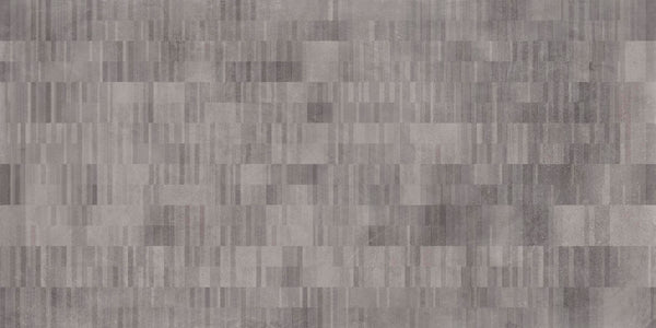 The Portland 24x48 Porcelain Tile features a modern, geometric look with an abstract pattern of small, rectangular grey tiles in varying shades and subtle imperfections, inspired by the Portland Collection.