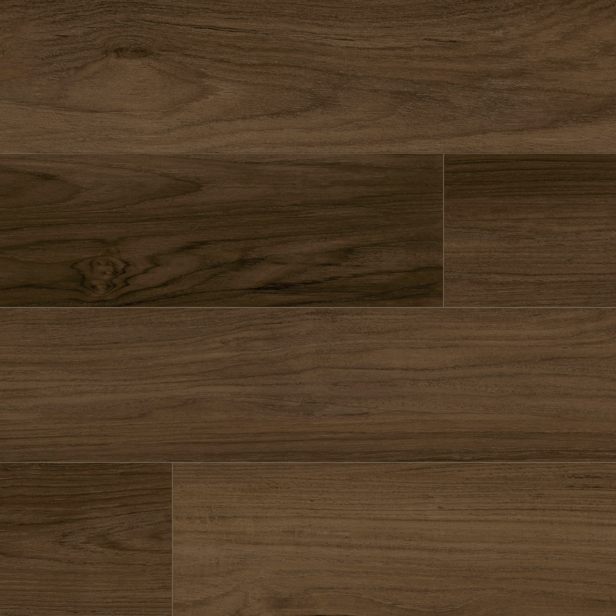Close-up view of GrandStep 9" Vinyl Plank flooring, showcasing its natural wood grain pattern and subtle tone variations in a staggered horizontal layout.