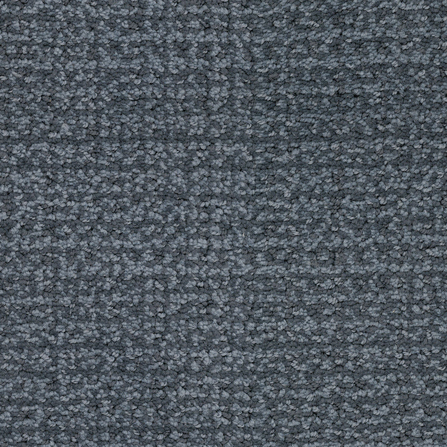A close-up of gray, looped Pedigree Pet Friendly Carpet fibers made with EnVisionSD Solution Dyed Nylon shows a textured, subtly patterned surface—ideal for stylish home interiors and superior stain resistance.