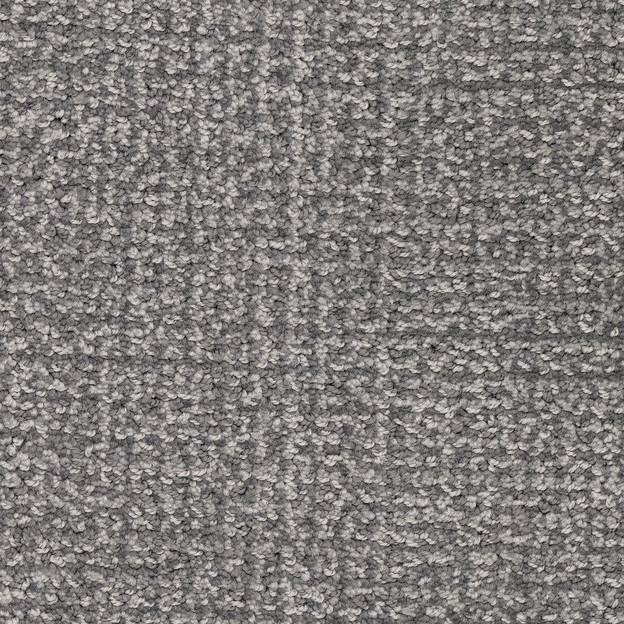Close-up of Pedigree Pet Friendly Carpet, featuring a textured gray looped pile made from EnVisionSD Solution Dyed Nylon. Its soft, even surface offers stain resistance and subtle shading, perfect for modern home interiors.
