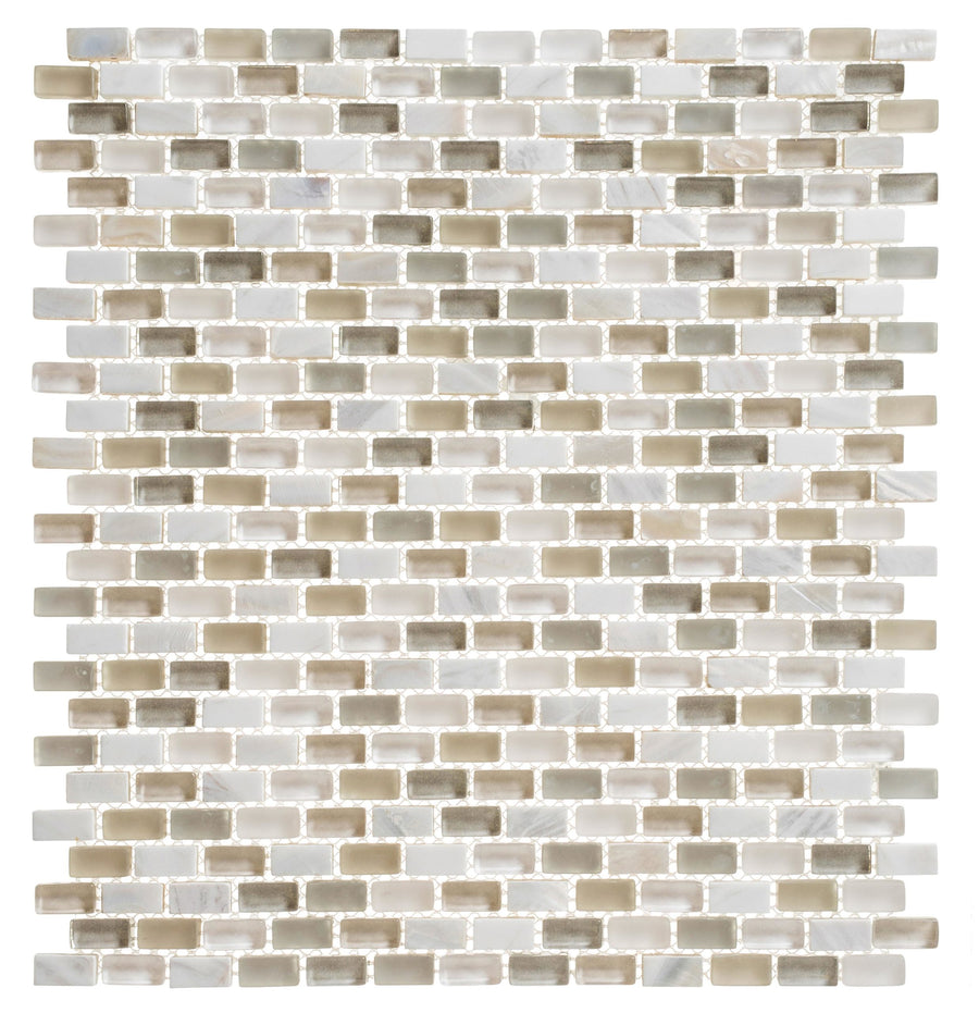 The Americana Glass Mosaic features small rectangular wall tiles in a brick pattern with glossy beige, white, and light brown tones, a subtle pearlescent finish, and refined glass accents for a stylish neutral look.