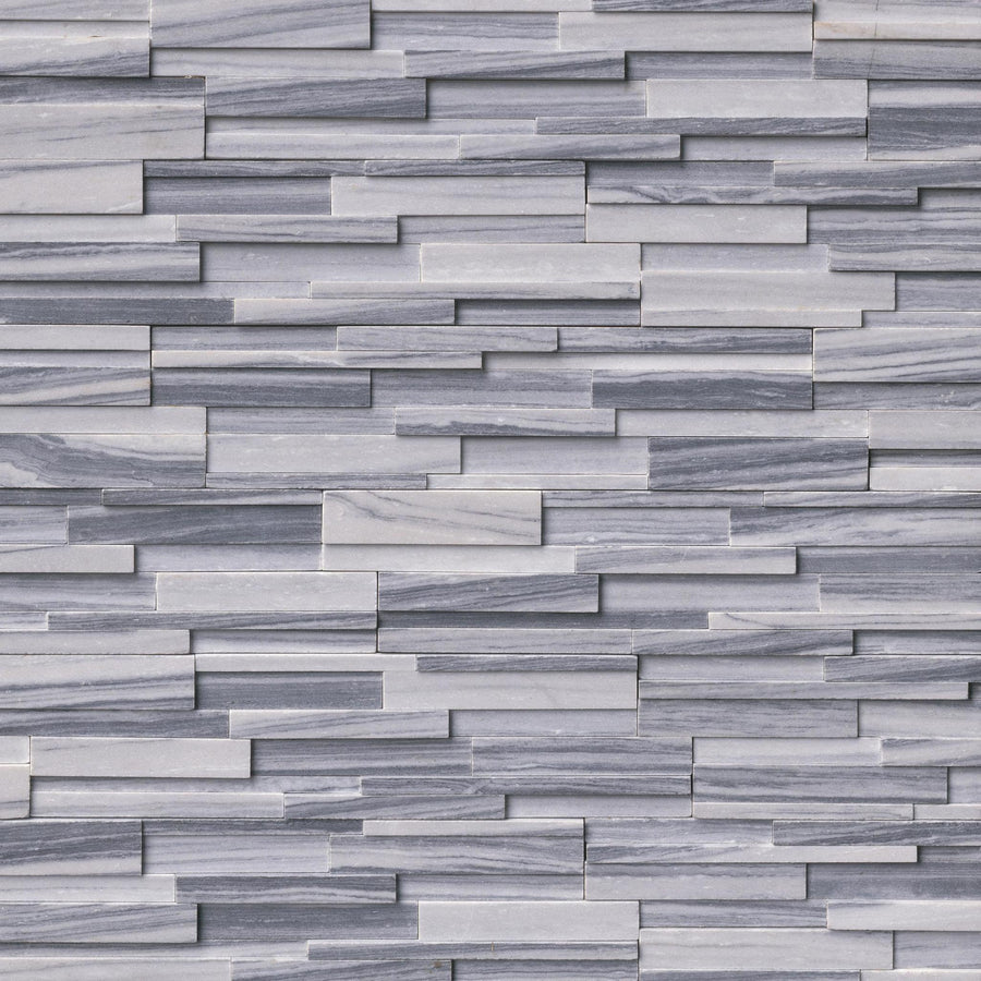 The Landscape 6x24 Natural Stone Ledger Panel features gray and white split face tiles in a staggered, stacked pattern for a textured, modern mosaic wall design.