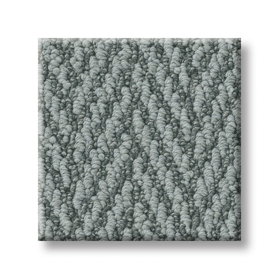 A close-up of the Always Natural On Trend Carpet shows a square gray premium swatch with a textured, looped herringbone pattern on a white background.