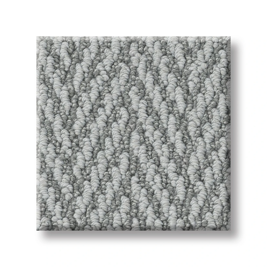 A close-up of a square sample of Always Natural On Trend Carpet in light gray, textured loop-pile with a subtle herringbone pattern, displayed on a white background.