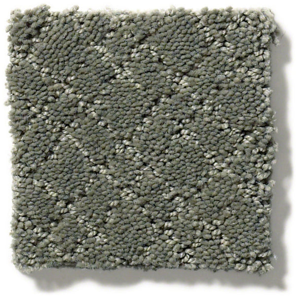 Mosaic Family Friendly Carpet is a square swatch of textured gray carpet with a subtle diamond pattern, crafted from continuous filament nylon for stain resistance, soft appearance, and a slightly raised looped pile.
