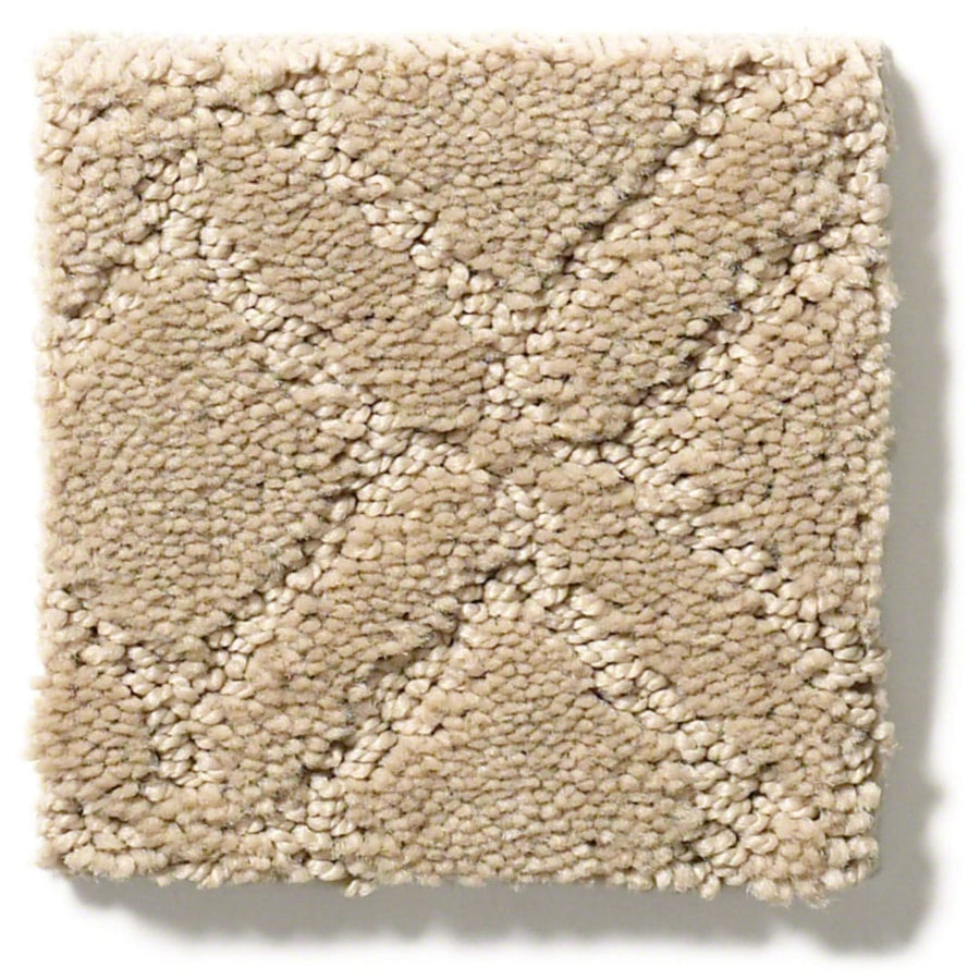 The Muse On Trend Carpet sample is a light beige square with a textured, raised diamond pattern. Intersecting diagonal lines form X shapes, creating a subtle box grid in neutral tones across its surface.