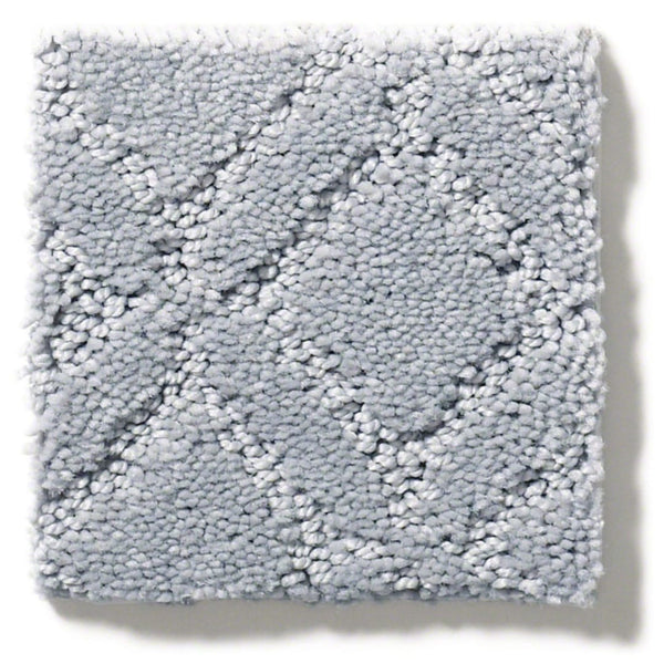 A square swatch of Muse On Trend Carpet in light gray, featuring a raised diamond geometric pattern in neutral tones with a soft, textured surface.