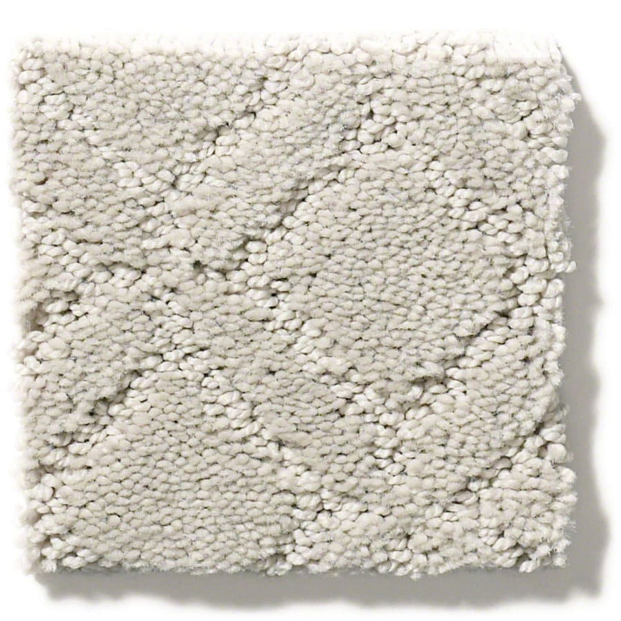 A square sample of Muse On Trend Carpet in light grey, featuring a soft, plush surface and a continuous pattern of subtle geometric diamond shapes in neutral tones.