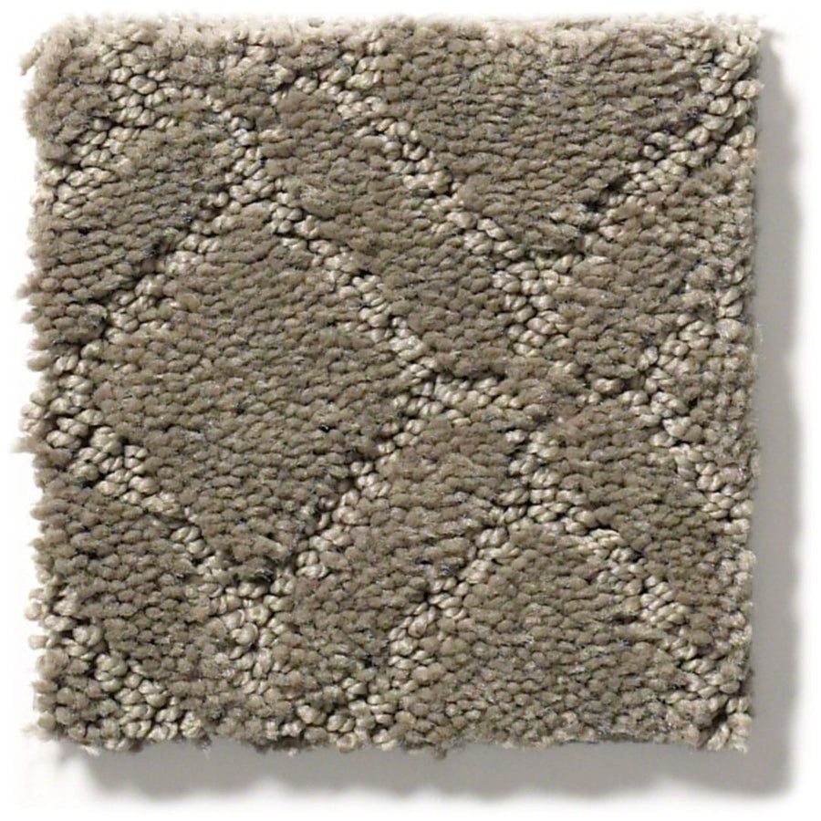 A square swatch of Muse On Trend Carpet in beige, featuring neutral shades and a diamond-textured pattern with mixed short and looped fibers, is shown on a white background. The continuous design brings visual interest to any space.
