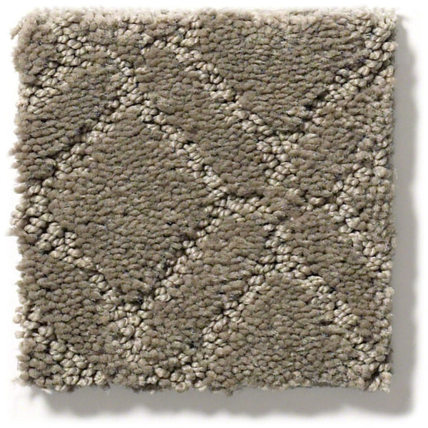 A square swatch of Muse On Trend Carpet in beige, featuring neutral shades and a diamond-textured pattern with mixed short and looped fibers, is shown on a white background. The continuous design brings visual interest to any space.