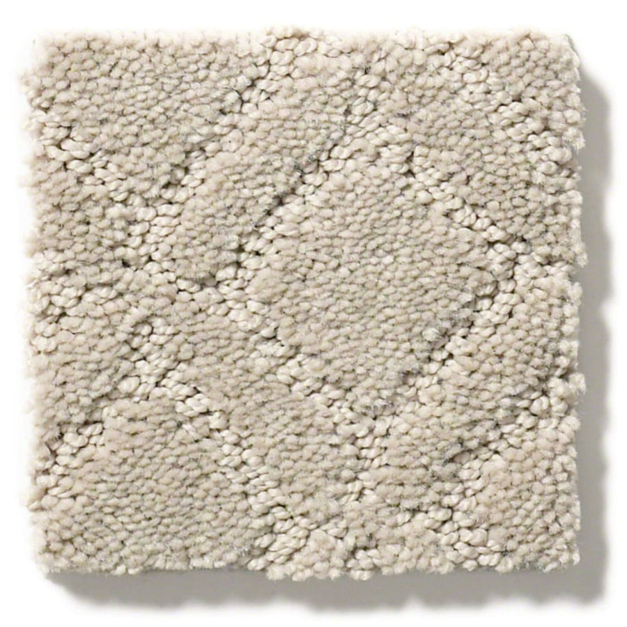 A close-up of Muse On Trend Carpet shows a square swatch in light beige with a subtle box grid texture. The neutral shades and plush, soft fibers give the carpet an inviting, stylish look.