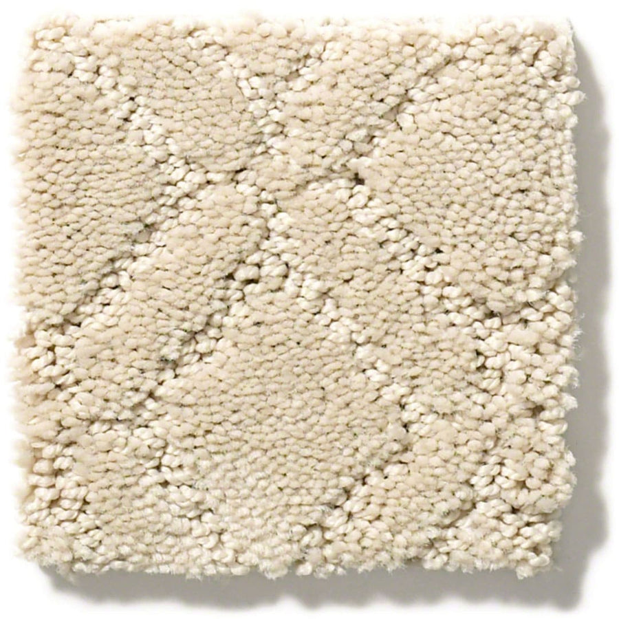 The Muse On Trend Carpet features a beige, textured square swatch with a subtle diamond pattern. Its neutral tones and plush fibers offer a soft look, perfect for versatile interiors.