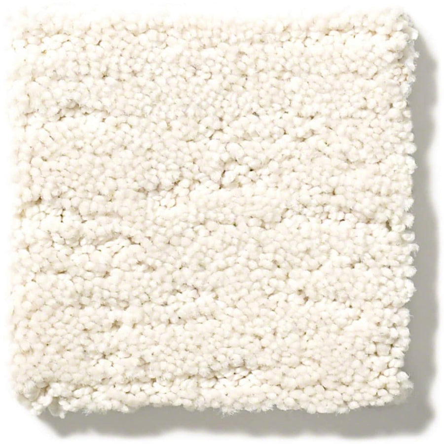 A sample of Sketch On Trend Carpet, a white textured nylon carpet in nature-inspired neutrals, offers soil and stain resistance with a soft, plush feel and a subtly uneven surface.