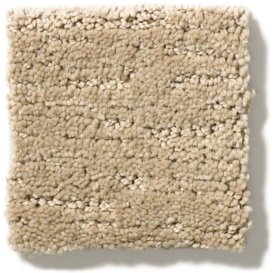 The Sketch On Trend Carpet is a square beige swatch with nature-inspired neutrals and a soft, plush texture. Crafted from soil- and stain-resistant nylon, it features subtle pile height variations and is displayed against a white background.