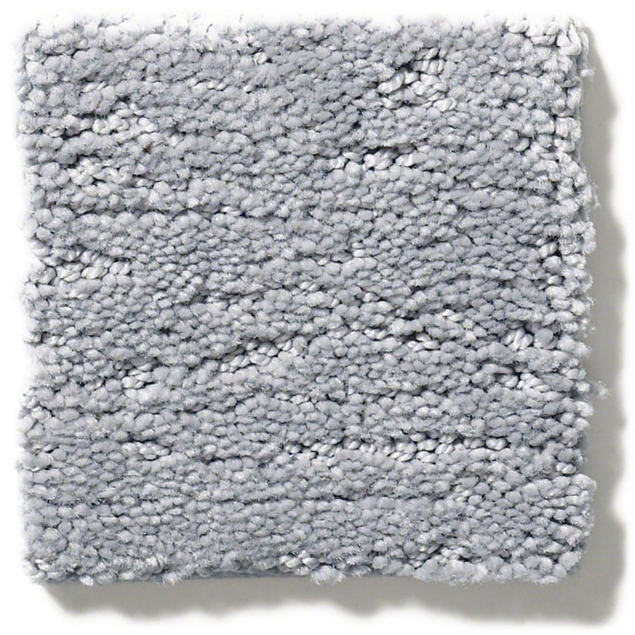 Sketch On Trend Carpet: A square swatch of light gray, nature-inspired neutral textured carpet with plush, tightly woven fibers and a subtly uneven surface, made from soil- and stain-resistant nylon, shown on a white background.