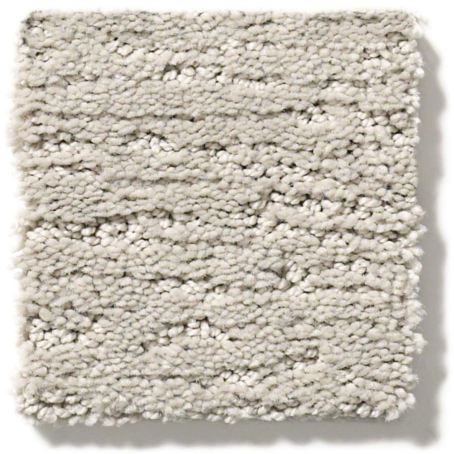 The Sketch On Trend Carpet is a square swatch of light gray, textured carpet with a looped, uneven pile. Made from stain- and soil-resistant nylon, it offers thick, closely packed fibers in nature-inspired neutrals for a soft feel.