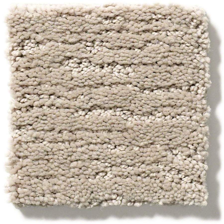 A square swatch of Sketch On Trend Carpet, a light beige, nature-inspired neutral with a plush nylon pile and subtle horizontal lines, offers soil and stain resistance. The textured sample appears on a white background.