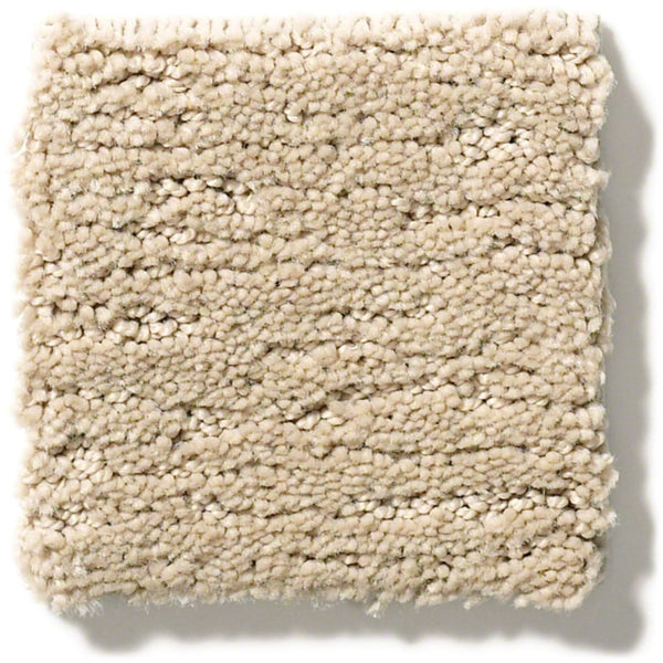 A close-up of a square swatch of Sketch On Trend Carpet in beige, nature-inspired neutrals, featuring a soft, looped pile with slightly uneven nylon fibers that resist soil and stains.