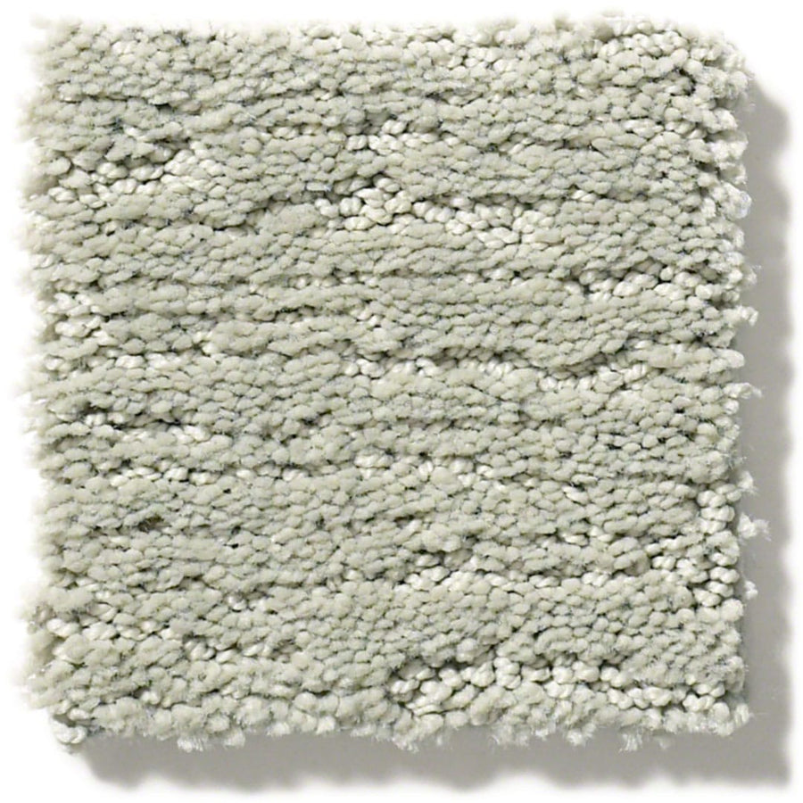 A square sample of Sketch On Trend Carpet in light gray, with tightly woven, looped fibers made from soil and stain-resistant nylon in natural neutrals, shown against a white background.