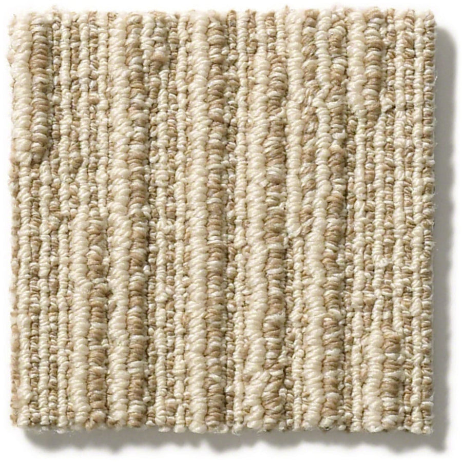 A square sample of Chase Pet Friendly Carpet in beige, featuring looped fibers in vertical rows for a soft linear texture. The plush, slightly raised surface adds subtle interest to versatile neutral décor.