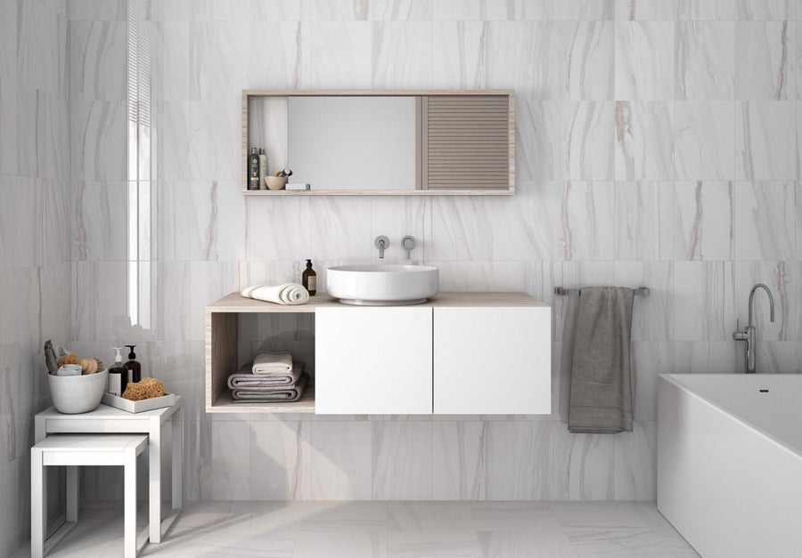 Minimalist bathroom featuring Angel Falls 10x13 Glossy Porcelain Tile on the floor and walls, white marble accents, a round sink on a floating vanity, open and closed shelving, mirror above, towel rack, and bathtub to the right.