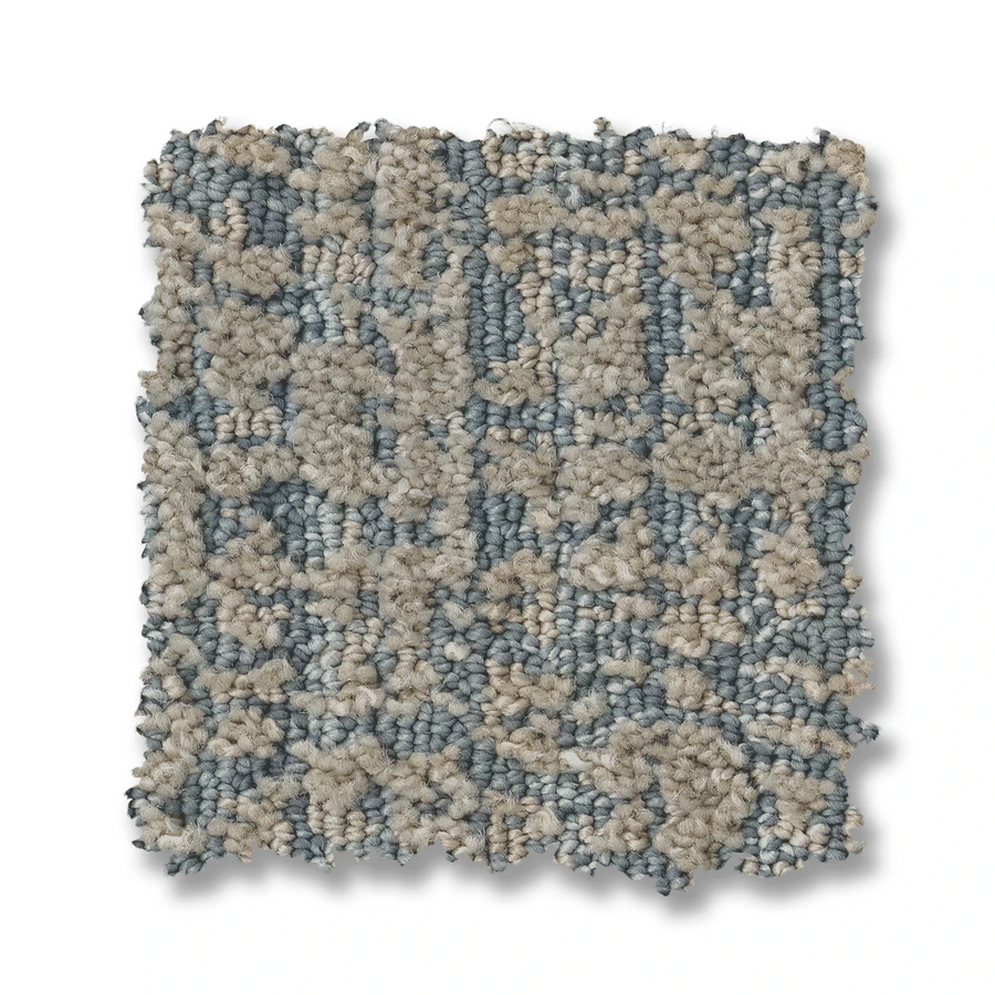 A square swatch of Batique On Trend Carpet features an abstract, textured loop pattern in light gray and blue shades, set against a white background.