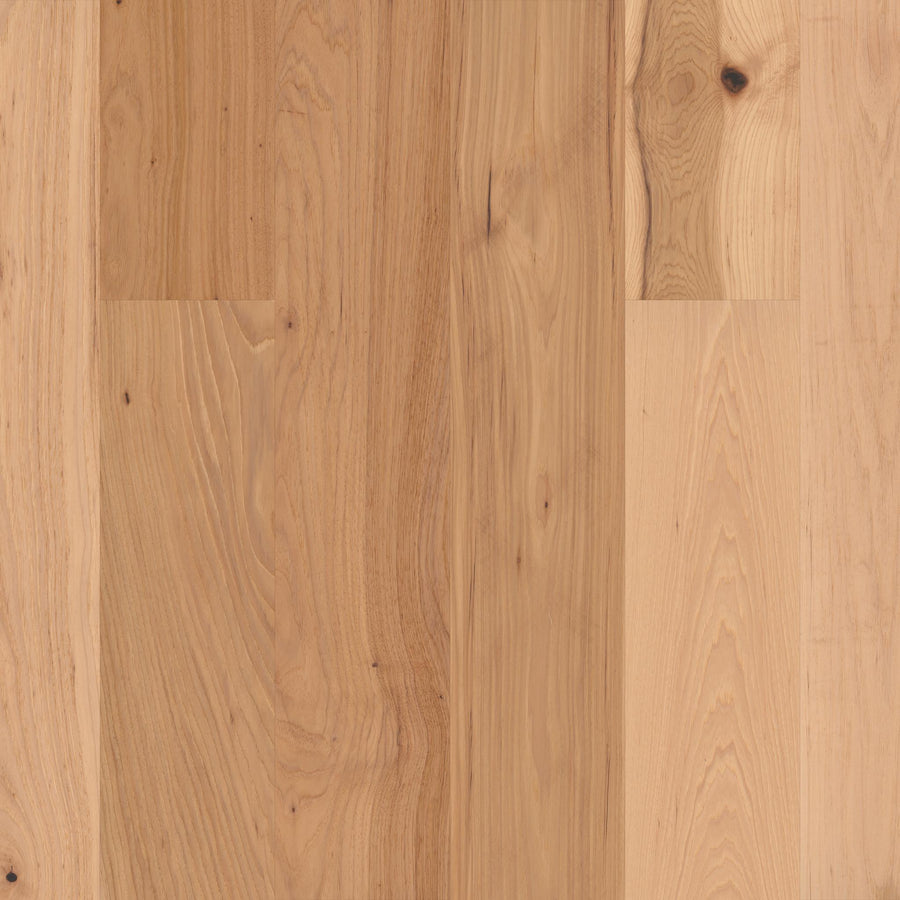 Close-up of Biltmore Hickory & White Oak 7 1/2" Hardwood planks with a low-gloss finish, natural grain, and subtle knots in light to medium brown tones, highlighting the classic elegance of heirloom hardwood.