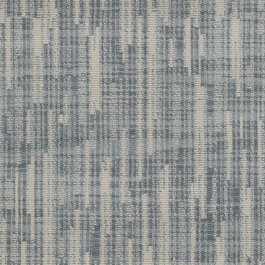 Blurred Lines On Trend Carpet features an abstract woven pattern with vertical and horizontal lines in blue and white shades, creating a textured look reminiscent of photography-inspired designs.
