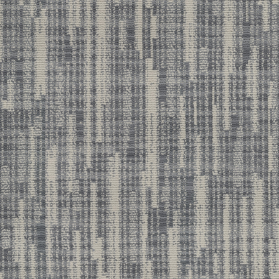 The Blurred Lines On Trend Carpet features a modern woven pattern with vertical and horizontal blue and white lines, creating a textured look that resembles digital static or photography-inspired design in varying blue shades.
